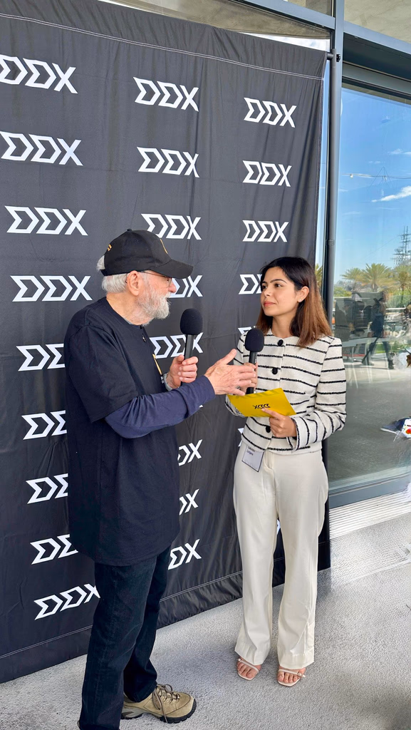 interviewing a speaker at the DDX conference